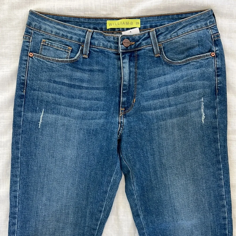 William B size 29 medium wash zipper slit slim straight leg jean. New with tag